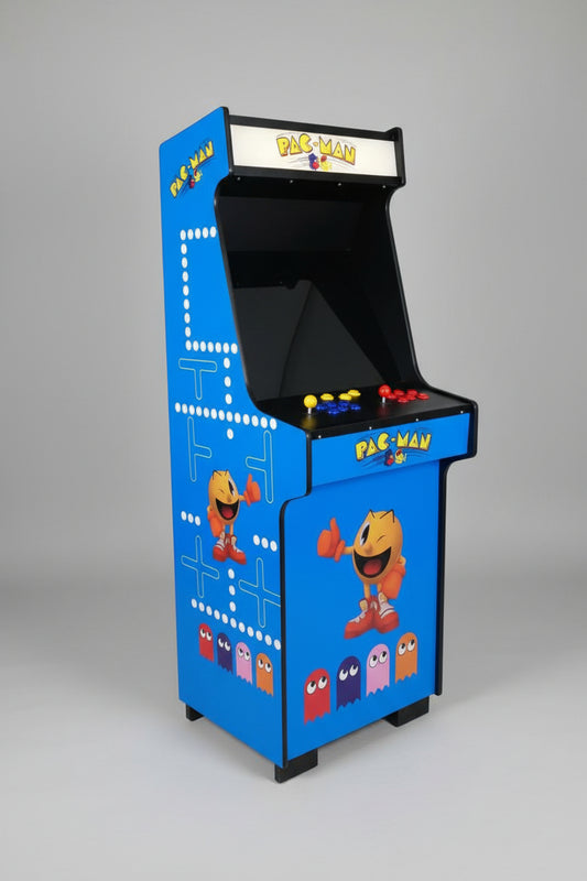 Pac-Man arcade machine in a room with a door and wall decorations.